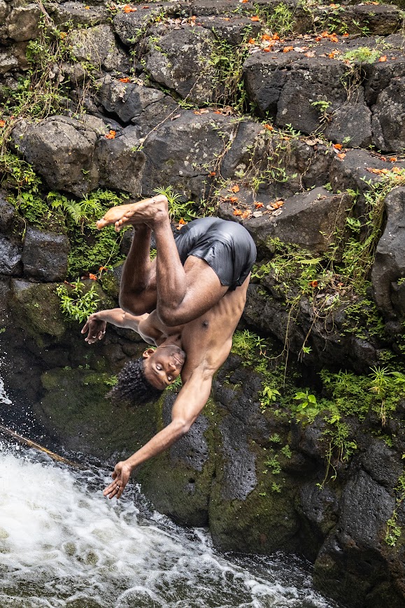 Fantasy Waterfall Extravaganza man flipping into water